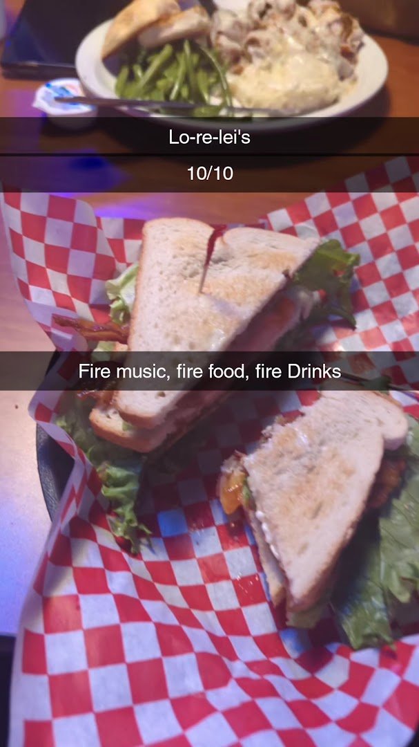 Live music stage beside a laid-back restaurant floor.
